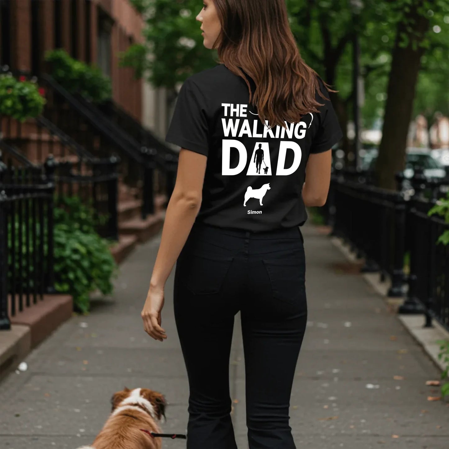 Woman walking dog on sidewalk - Black