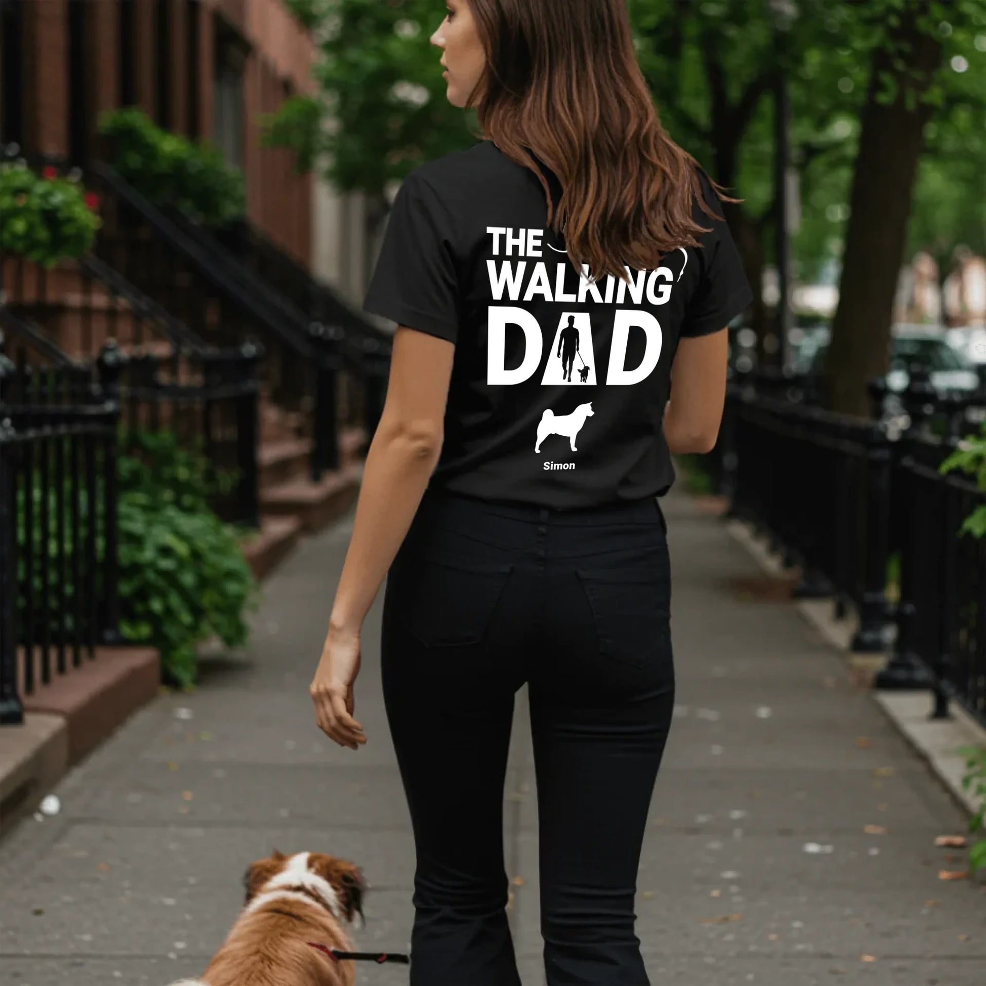 Woman walking dog on sidewalk - Black